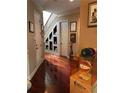 Spacious hallway with hardwood floors and built-in shelving at 1175 Grassy Oat Ln, Lawrenceville, GA 30045