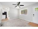 Bright living room with grey carpet, and view of kitchen at 2623 Rex Sw Ave, Atlanta, GA 30331