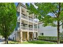 Three-story home with stone base and wrap-around porch at 956 Glenwood Park Se Dr, Atlanta, GA 30316