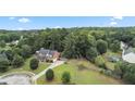 Aerial view of house, large backyard, and surrounding neighborhood at 1500 Terminal Ct, Mcdonough, GA 30252