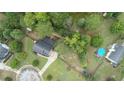 High-angle view of house, yard, and above-ground pool at 1500 Terminal Ct, Mcdonough, GA 30252