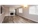 Bright living room featuring a fireplace and hardwood floors at 3814 N Camp Creek Sw Pkwy, Atlanta, GA 30331