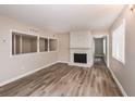 Spacious living room with hardwood floors and a fireplace at 3814 N Camp Creek Sw Pkwy, Atlanta, GA 30331