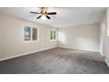 Large bedroom with neutral walls and carpet, ceiling fan at 4649 Big Valley Ct, Stone Mountain, GA 30083