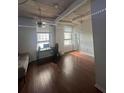 Bright living room with hardwood floors, large windows, and a workspace at 20 Marietta St # 9F, Atlanta, GA 30303
