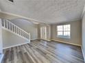Spacious living room featuring hardwood floors and natural light at 12497 Lakeside Pkwy, Fayetteville, GA 30215
