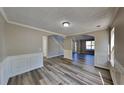 Open dining room with hardwood floors and archways at 12497 Lakeside Pkwy, Fayetteville, GA 30215