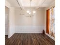 Formal dining room with hardwood floors and wainscoting at 188 Sophie Cir, Locust Grove, GA 30248