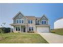 Two-story craftsman style home with green and stone exterior at 204 Blanton Ln, Stockbridge, GA 30281