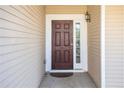 Inviting front door entrance with sidelight at 421 Bedford Xing, Mcdonough, GA 30253