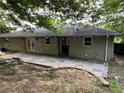 Back patio with flagstone flooring and string lights at 2334 Elmwood Se Dr, Atlanta, GA 30339