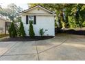 White brick home with black shutters and a driveway at 2911 Glenwood Se Ave, Atlanta, GA 30317