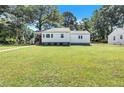 Front view of a charming white house at 2408 Hillcrest Dr, East Point, GA 30344