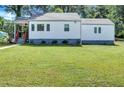 White house with gray base and green lawn at 2408 Hillcrest Dr, East Point, GA 30344