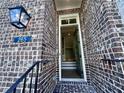 Brick home with a welcoming front porch and entryway at 265 Briscoe Way # 4, Alpharetta, GA 30009