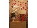 Entryway with red floral wallpaper, a mirror, and a lamp at 88 W Paces Ferry Nw Rd # 1130, Atlanta, GA 30305