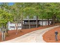 Ranch home nestled in a wooded setting with a long driveway at 2228 Old Dallas Sw Rd, Marietta, GA 30064