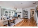 Spacious living room with hardwood floors and a fireplace at 975 Woodbury Rd, Canton, GA 30114