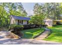 Brick ranch home with a driveway and walkway leading to the entrance at 4323 Autumn Hill Dr, Stone Mountain, GA 30083