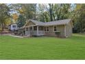 Single-story house with green lawn and covered porch at 3225 Fern Dr, Tucker, GA 30084