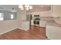 Modern kitchen featuring stainless steel appliances and granite countertops at 5108 Galbraith Cir, Stone Mountain, GA 30088