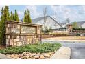 Community entrance with a stone sign, landscaping, and a welcoming atmosphere at 3351 Orwell Way # 2105, Cumming, GA 30041