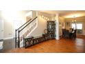 Open dining room and entryway with hardwood floors and staircase at 4000 Longlake Dr, Duluth, GA 30097