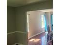 Bright dining room with hardwood floors and view into adjacent living area at 4769 Snap Creek Ln, Decatur, GA 30035