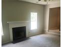 Living room features a fireplace and neutral carpeting at 4769 Snap Creek Ln, Decatur, GA 30035