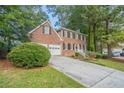 Brick house with two-car garage and landscaped yard at 2097 Kolb Ridge Sw Ct, Marietta, GA 30008