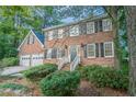 Two-story brick home with a double-door entry and landscaping at 2097 Kolb Ridge Sw Ct, Marietta, GA 30008