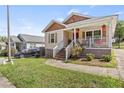 Exterior view of a charming house with a front yard and driveway at 2478 Verbena Cir, Atlanta, GA 30314