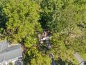 Aerial view of the house nestled among trees, showing the roof and driveway at 5051 Heather Se Rd, Smyrna, GA 30082