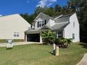 Two-story house with attached garage at 345 Meadows Ln, Canton, GA 30114