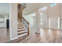 Bright and airy entryway with staircase and wood-look flooring at 3306 Summer Brooke Ln, Union City, GA 30291