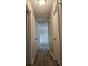 Hallway with light walls and wood-look flooring at 255 Bellwood Ln, Riverdale, GA 30274