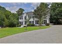 Two-story white brick house, long driveway at 3126 Crestmont Nw Way, Kennesaw, GA 30152