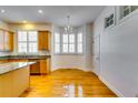 Bright kitchen with hardwood floors, granite counters, and wood cabinets at 1266 Creekside Se Ter, Smyrna, GA 30082