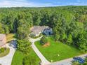 House with a large lot and beautiful landscaping, viewed from above at 1565 Mountain Shadow Trl, Stone Mountain, GA 30087