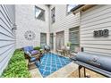Relaxing patio with seating area, grill, and decorative rug at 3517 Village Park Nw Way, Kennesaw, GA 30144