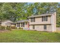 House exterior with carport and landscaped yard at 139 Old Mill Sw Trl, Conyers, GA 30094