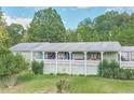 Ranch style home with large covered porch and spacious yard at 4310 Bryan Se Ln, Acworth, GA 30102