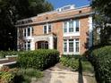 Charming brick house with well-manicured landscaping and a walkway at 242 12Th Ne St # 8, Atlanta, GA 30309