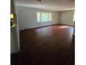 Spacious living room featuring hardwood floors and large windows at 3565 Glenwood Rd, Decatur, GA 30032