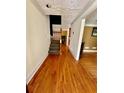Hardwood floors and staircase in the entryway at 2735 Sandy Creek Cir, Loganville, GA 30052