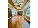 Spacious living room with hardwood floors and stone fireplace at 2735 Sandy Creek Cir, Loganville, GA 30052