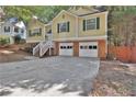 Two story home with double garage and a large yard at 2607 Marleigh Farm Nw Rd, Kennesaw, GA 30152