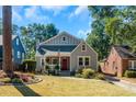 Charming gray house with red door and yard at 1688 Richland Sw Rd, Atlanta, GA 30311