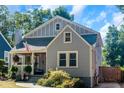 Quaint gray house with red door and yard at 1688 Richland Sw Rd, Atlanta, GA 30311