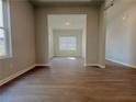 Open living room with hardwood floors and lots of natural light at 11808 Rizvan Pl, Covington, GA 30014